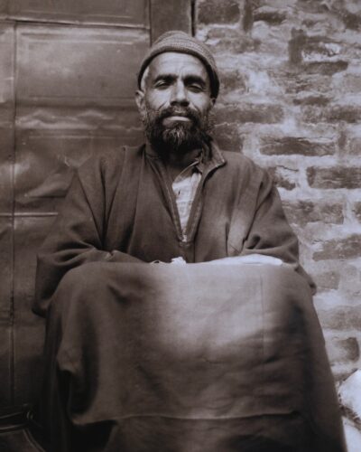 Analogue film photography potrait of a local man in Srinagar, Kashmir, India, traditional black and white travel documentary style, by Jeroen Busschers