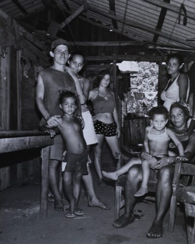Analogue film photography of a Cuban family inside their rural wooden home, Cuban Interiors series by Jeroen Busschers